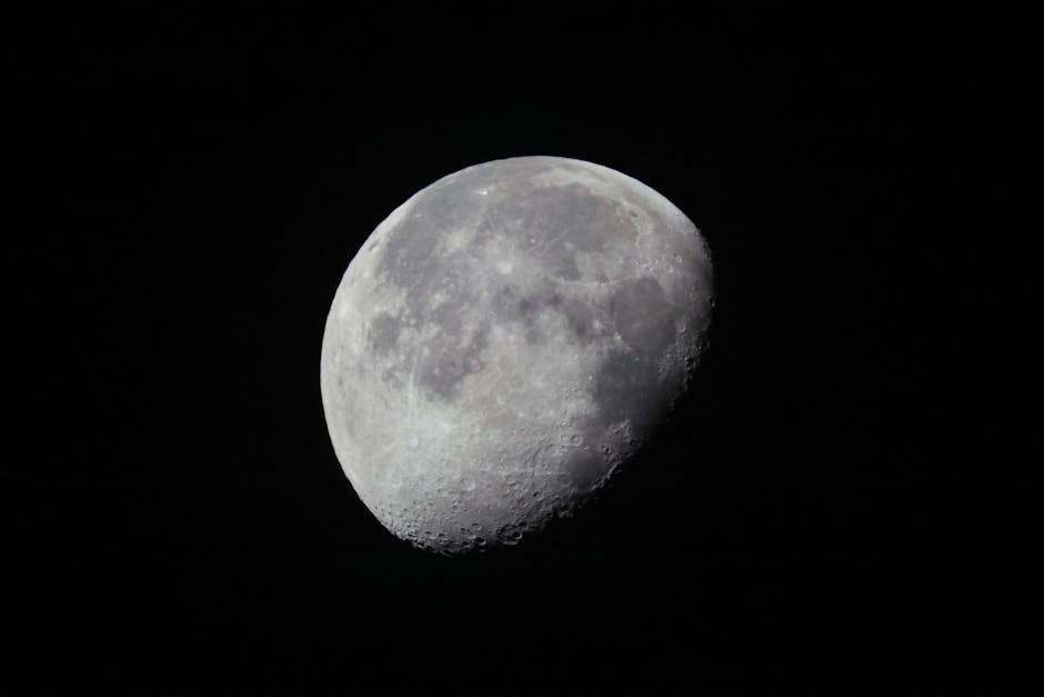 Detailed view of the waning gibbous moon set against a dark night sky.
